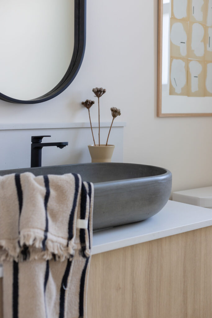 Modern Custom Home Stone sink with black accents in Kamloops