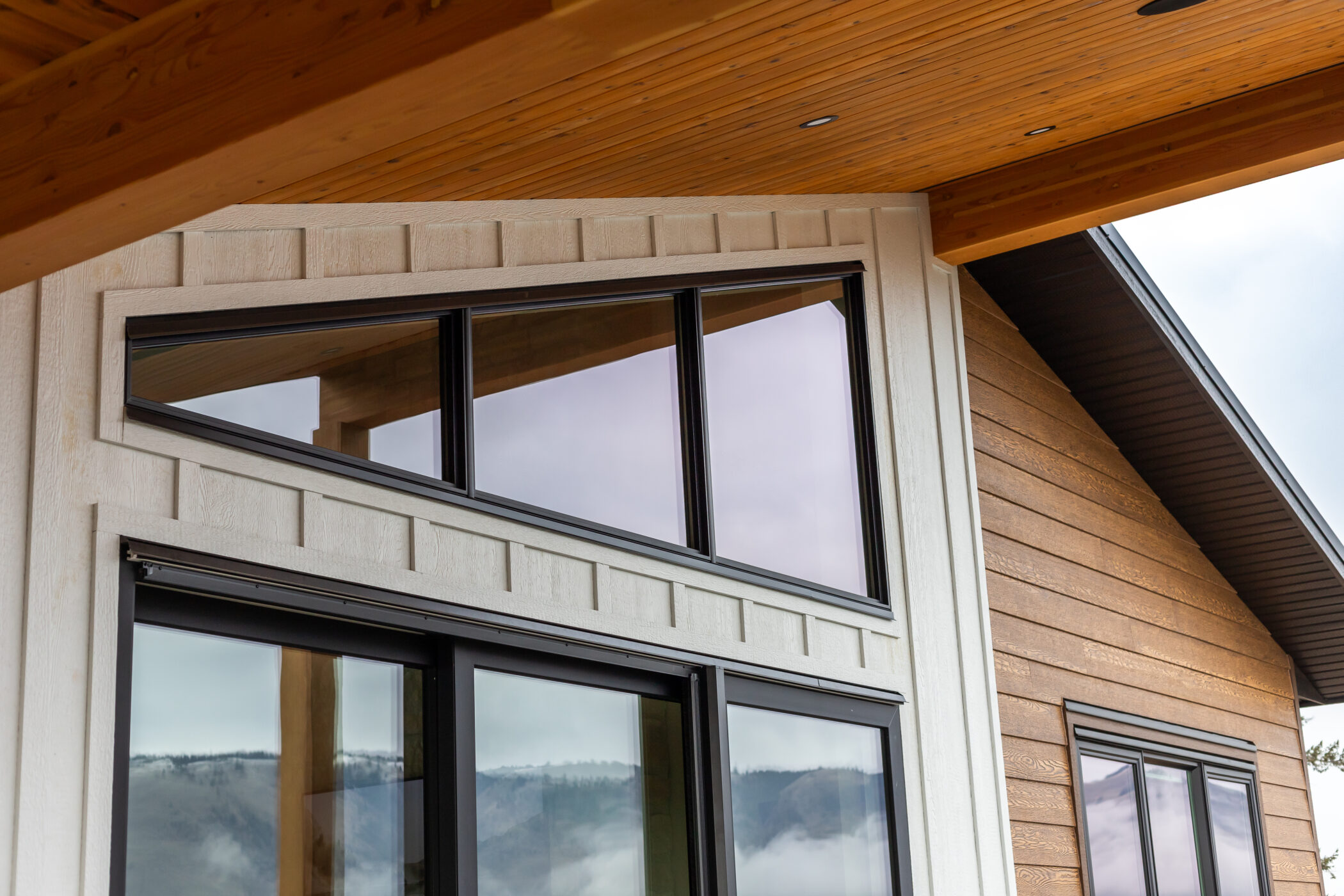 Architectural exterior showcasing bold roof shapes and modern window design in Kamloops home