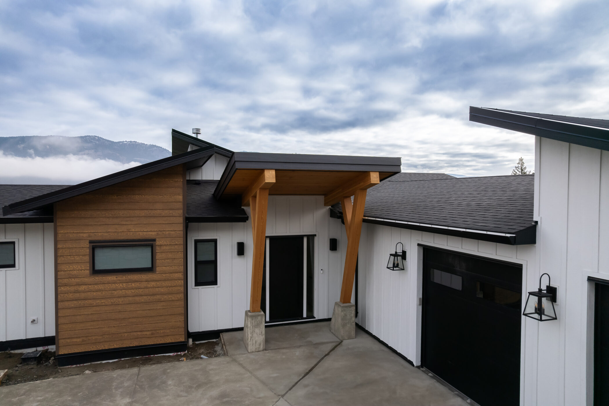 Modern custom home exterior with mountain views in Kamloops